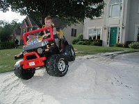 Andrew riding on sand pile